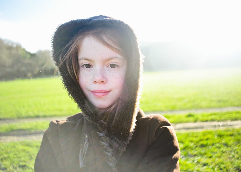 Girl wearing a hooded jacket in Marin Meadow